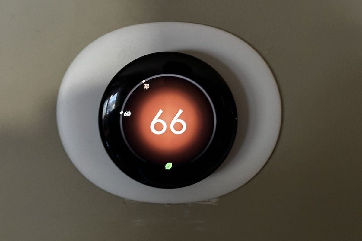 a photo of new Google Nest Learning Thermostat 4th Gen on a wall