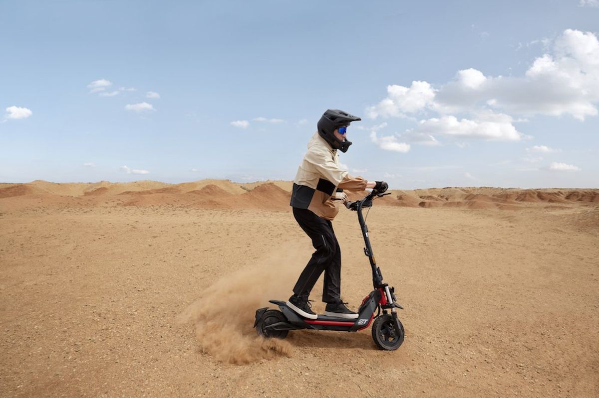 a man riding a Segway ZT3 Pro scooter in the desert