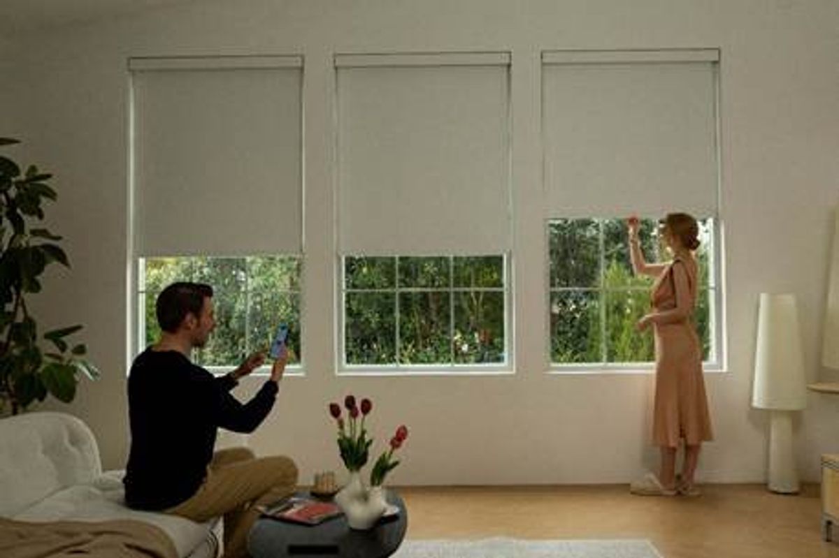 photo of a room with Graywind's Manumatic Roller Shade Collection on the windows.
